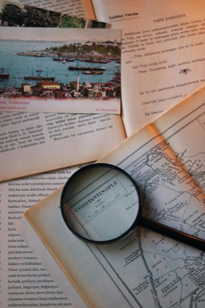 Explore historical maps and documents with a vintage magnifying glass.