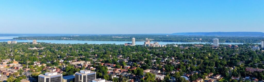 Stunning aerial view of Ottawa cityscape with Gatineau Hills in the background.